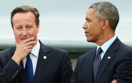 epa04385343 British Prime Minister David Cameron (L) and US President Barack Obama talk as Heads of State and Government gather to watch a military fly past in front of a Typhoon fighter jet during the NATO Summit 2014 at the Celtic Manor Resort in Newport, Wales, Britain, 05 September 2014. World leaders from about 60 countries are coming together for a two-day NATO summit taking place from 04-05 September.  EPA/FACUNDO ARRIZABALAGA (Newscom TagID: epalive346058.jpg) [Photo via Newscom]
