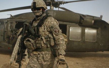 A Soldier exits a UH-60 Blackhawk helicopter in the village of Darrah-I-Bum, Badghis Province, Afghanistan Jan. 5, 2011. The Soldier was part of a cadre of personnel accompanying the International Security Assistance Force Command Sergeant Major, Command Sgt. Maj. Marvin L. Hill on a visit to the Marines, sailors, and Soldiers of Special Operations Task Force-West living and working in Darrah-I-Bum.   (U.S. Marine photo/Sgt. Brian Kester)