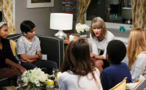 Singer Taylor Swift talks to New York City public school children about the power of reading and writing at an exclusive recording for Scholastic's 'Open a World of Possible' in October 2014. [AP]