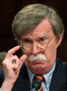 John Bolton adjusts his glasses during his testimony to the Senate Foreign Relations Committee, who are considering his nomination to be U.S. Ambassador to the United Nations, on Capitol Hill in Washington, July 27, 2006. Bolton has filled the post since 2005 under a recess appointment from U.S. President George W. Bush. REUTERS/Jonathan Ernst (UNITED STATES) - RTR1FVK1